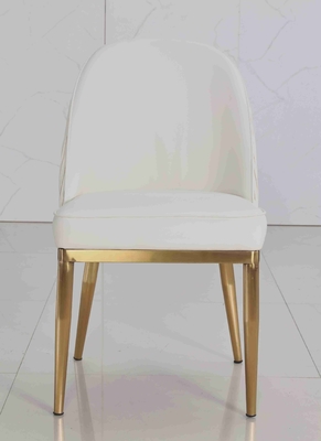La salle à manger capitonnée par tissu blanc de velours préside le cadre simple d'acier inoxydable d'or de série