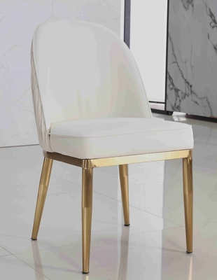 La salle à manger capitonnée par tissu blanc de velours préside le cadre simple d'acier inoxydable d'or de série
