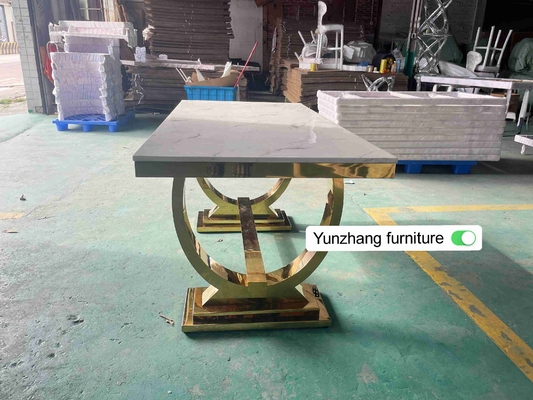 La table de salle à manger argentée de jambe d'acier inoxydable d'or a placé 6 Seater avec le dessus de marbre
