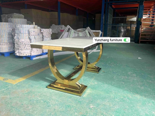 La table de salle à manger argentée de jambe d'acier inoxydable d'or a placé 6 Seater avec le dessus de marbre