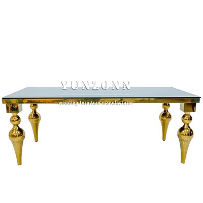 Bon prix Meuble de salle à manger d'hôtel à prix bon marché d'usine de Foshan, table de mariage en acier inoxydable doré avec dessus en verre miroir en ligne